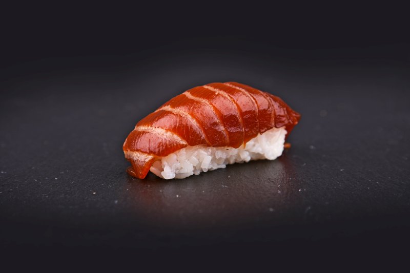 Salmon nigiri in hot teriyaki sauce