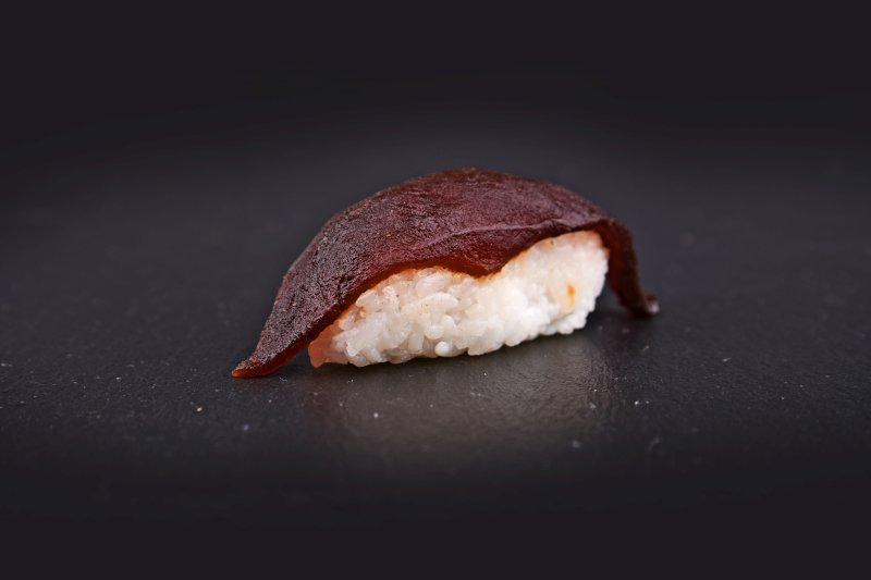Tuna nigiri in hot teriyaki sauce